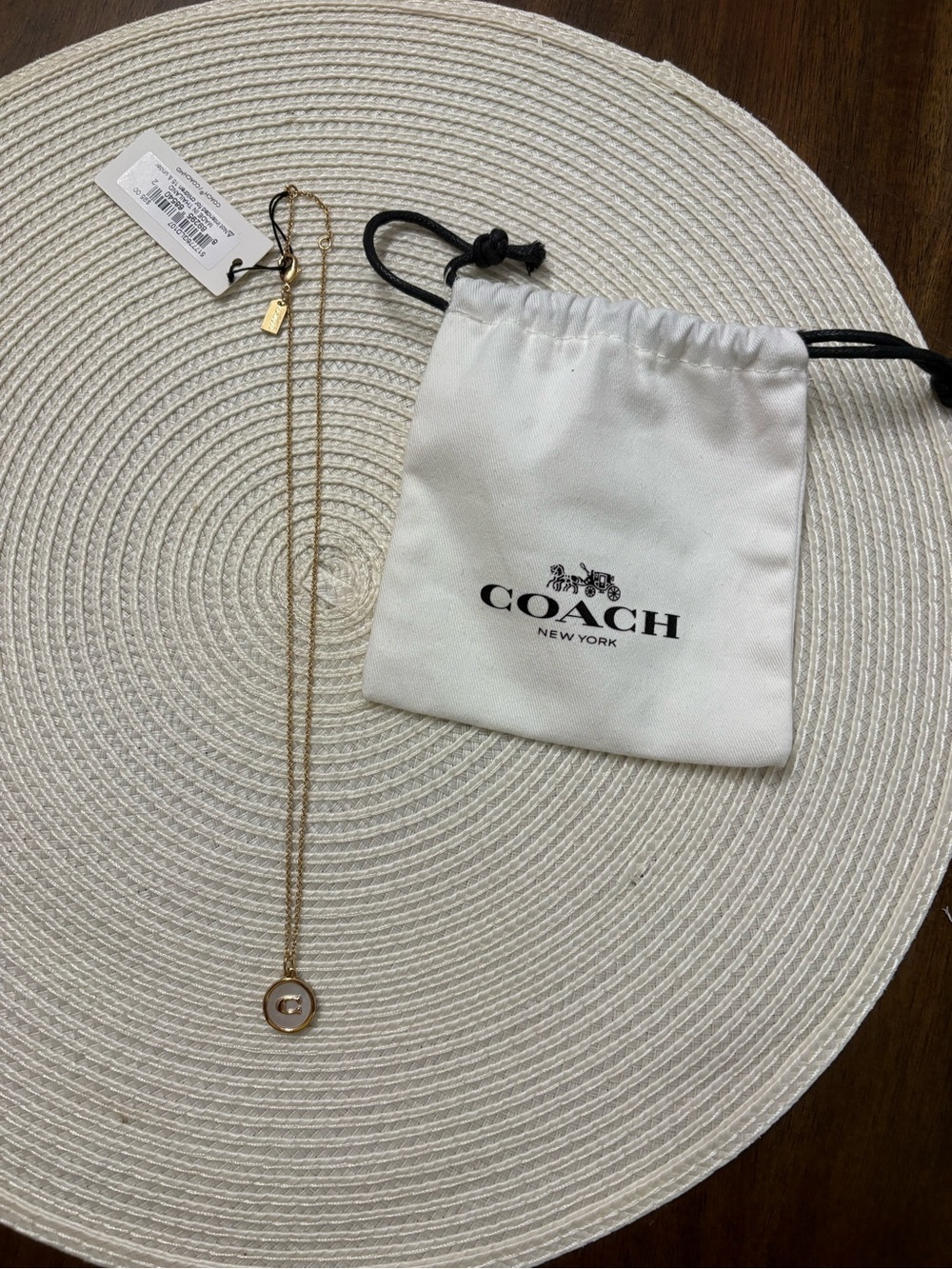 Coach Gold and White Circular Pendant Necklace